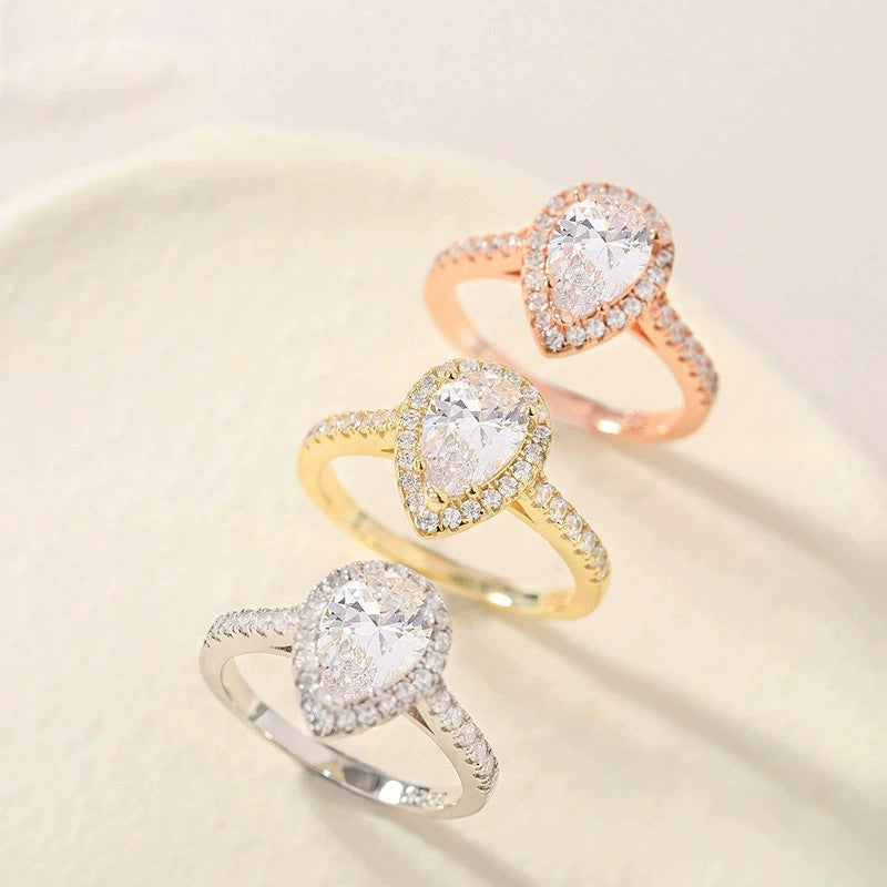Teardrop Zircon Inlaid Ring – Elegant Sparkle in Silver, Gold & Rose Gold